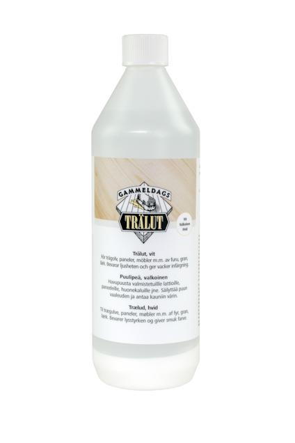 Vit plastflaska med etikett som visar texten "Gammeldags Trälut".